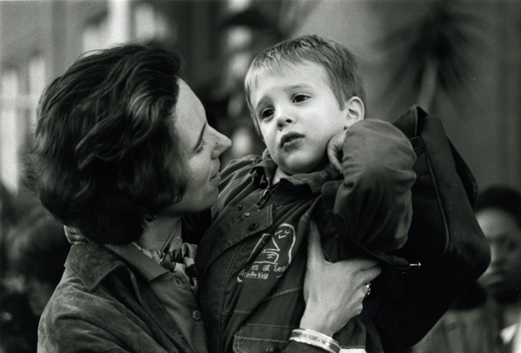A mum giving her little boy a pep talk. The boy would rather be elsewhere and is not being persuaded.